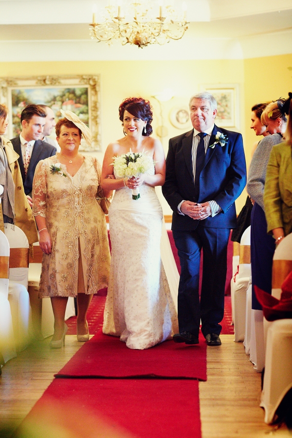 bride and father walking up aisle