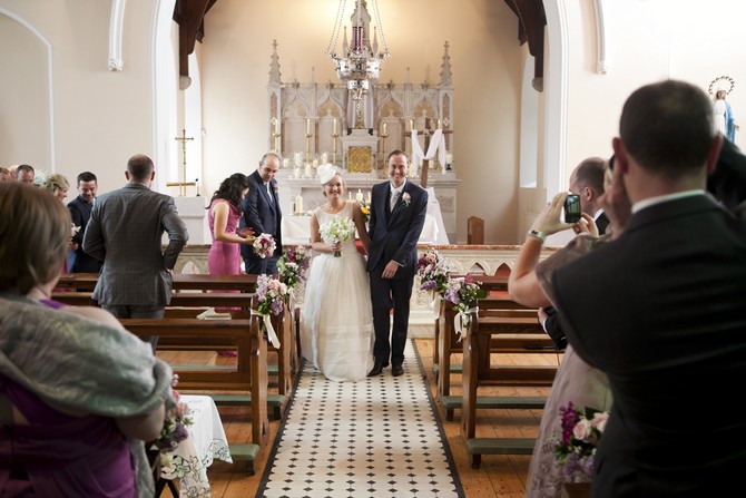 real wedding church ceremony weddingsonline.ie penry photography bride and groom walking down aisle