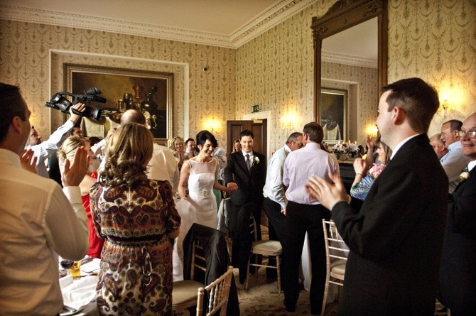 bride and groom entering reception