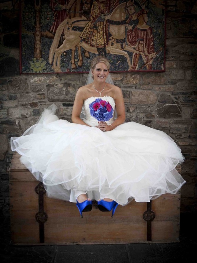 bride with blue and pink wedding bouquet