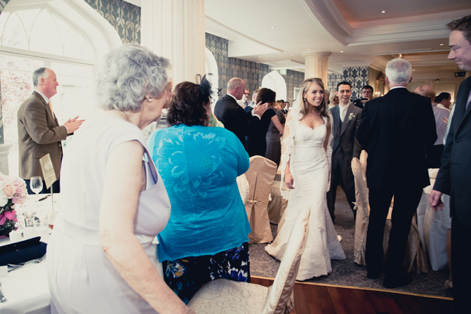 wedding couple entering reception